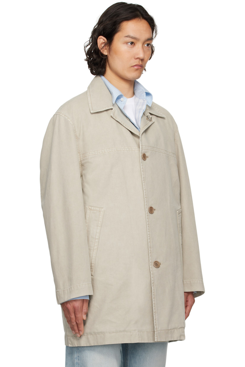 Cotton canvas coat.

· Detachable logo hardware at open spread collar
· Button closure
· Welt pockets
· Buttoned vent at side seams
· Dropped shoulders
· Adjustable button tab at cuffs
· Patch pockets at interior
· Partial cotton twill lining

Supplier color: Khaki
