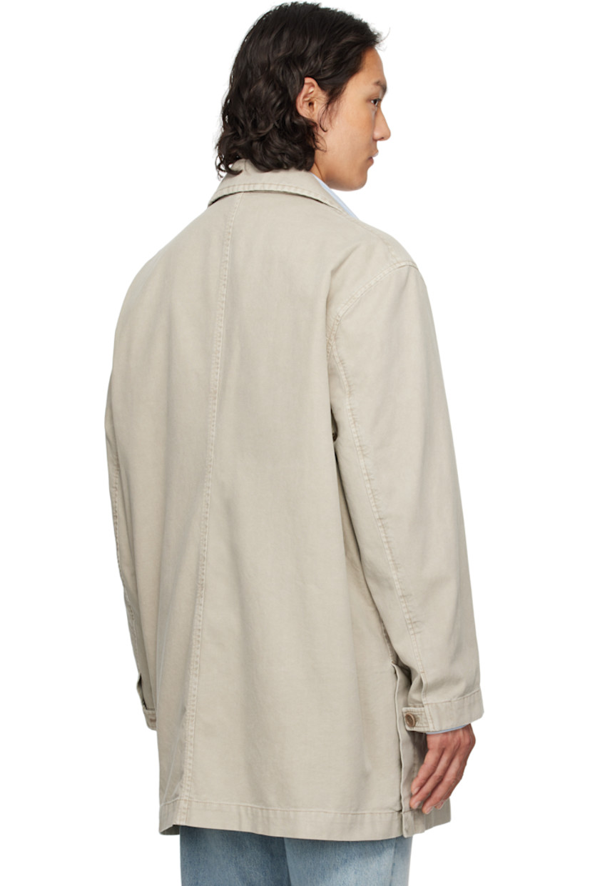 Cotton canvas coat.

· Detachable logo hardware at open spread collar
· Button closure
· Welt pockets
· Buttoned vent at side seams
· Dropped shoulders
· Adjustable button tab at cuffs
· Patch pockets at interior
· Partial cotton twill lining

Supplier color: Khaki
