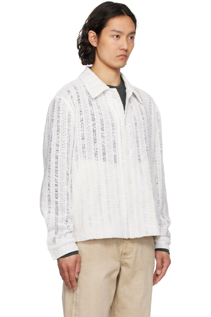 Crocheted cotton-blend jacket. Laddering throughout. 

· Spread collar
· Button closure
· Welt pockets
· Vented side seams
· Single-button barrel cuffs

Supplier color: White