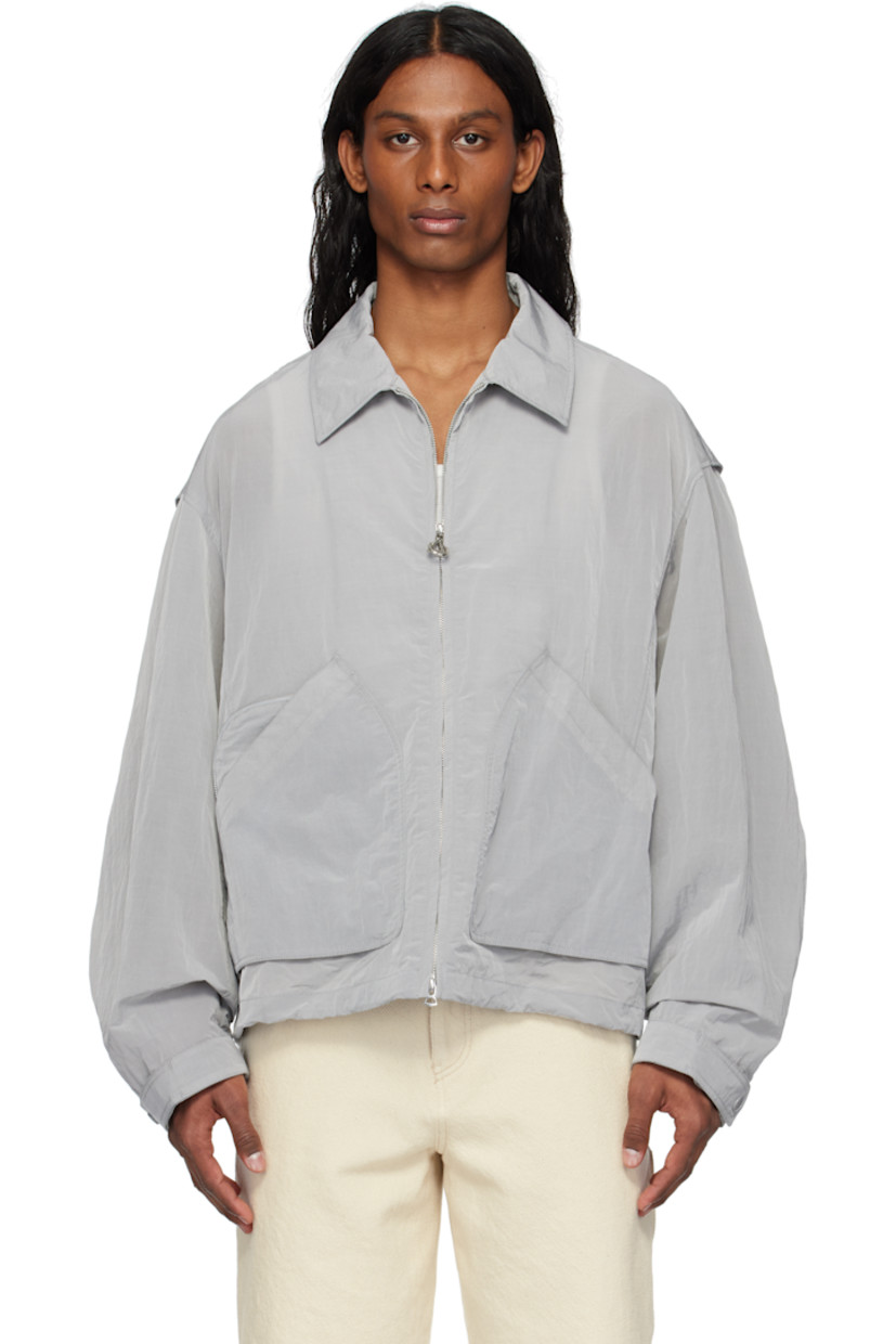 Crinkled nylon taffeta jacket.

· Spread collar
· Two-way zip closure
· Patch and zip pockets
· Bungee-style drawstring at hem
· Zip vent at side seams
· Adjustable press-stud tab at cuffs
· Press-stud expansion panels at back

Supplier color: Gray