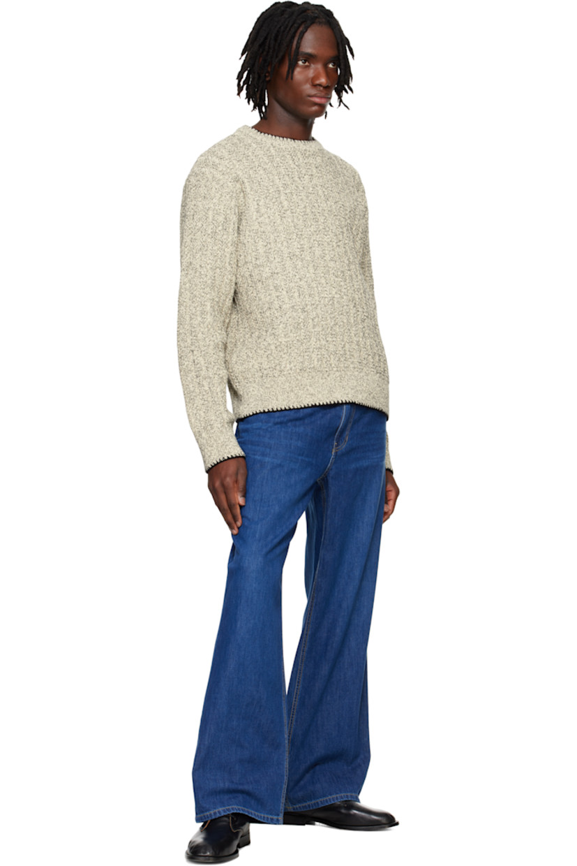 Bootcut non-stretch denim jeans. Fading and whiskering throughout. 

· Belt loops at elasticized waistband 
· Five-pocket styling 
· Zip fly 
· Suede logo patch at back waistband 
· Logo-engraved silver-tone hardware
· Contrast stitching in tan

Supplier color: Blue