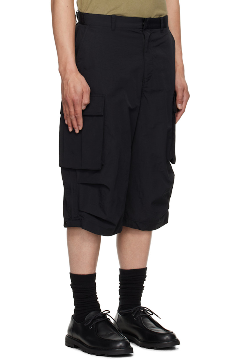 Nylon twill cargo shorts. 

· Belt loops
· Four-pocket styling
· Zip fly
· Pleats at knees
· Cargo pocket at outseams
· Zip expansion panel with press-stud tab at outseams

Supplier color: Black