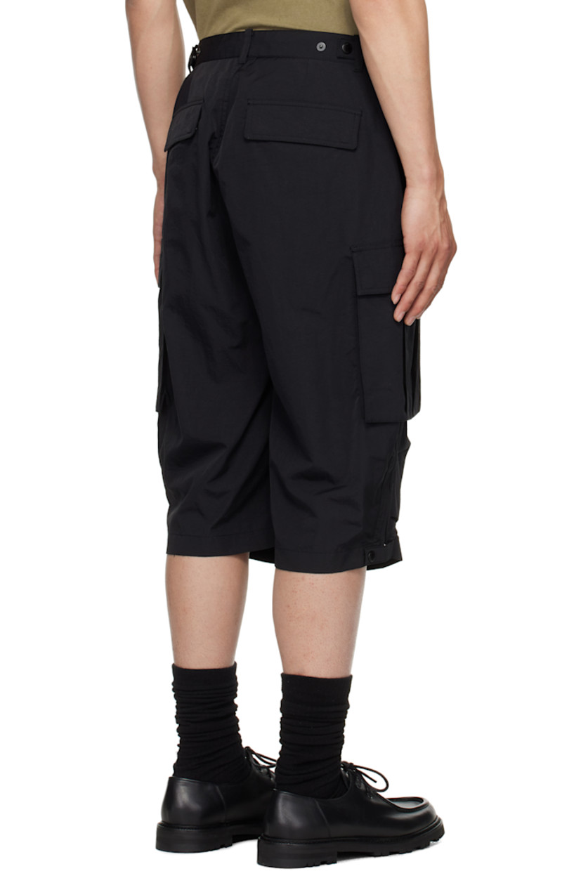 Nylon twill cargo shorts. 

· Belt loops
· Four-pocket styling
· Zip fly
· Pleats at knees
· Cargo pocket at outseams
· Zip expansion panel with press-stud tab at outseams

Supplier color: Black