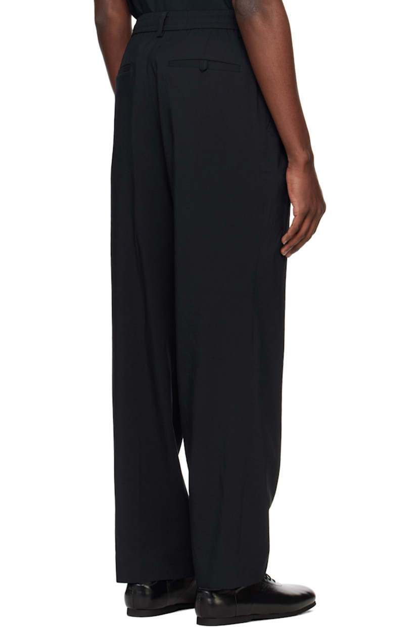 Wide-leg knit polyester- and cotton-blend terry trousers. 

· Belt loops
· Concealed drawstring at elasticized waistband 
· Four-pocket styling 
· Zip fly 
· Darts at back 

Supplier color: Black