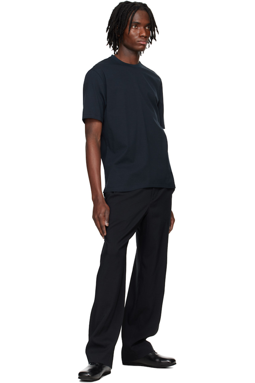 Wide-leg knit polyester- and cotton-blend terry trousers. 

· Belt loops
· Concealed drawstring at elasticized waistband 
· Four-pocket styling 
· Zip fly 
· Darts at back 

Supplier color: Black