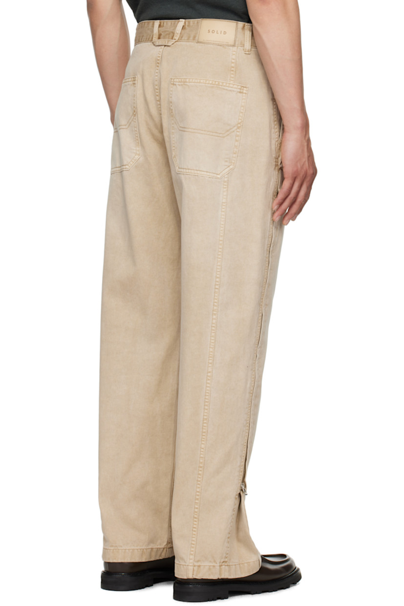 Wide-leg cotton twill trousers. 

· Belt loops
· Four-pocket styling
· Zip fly
· Zip expansion panel at outseams
· Leather logo patch at back waistband

Supplier color: Beige