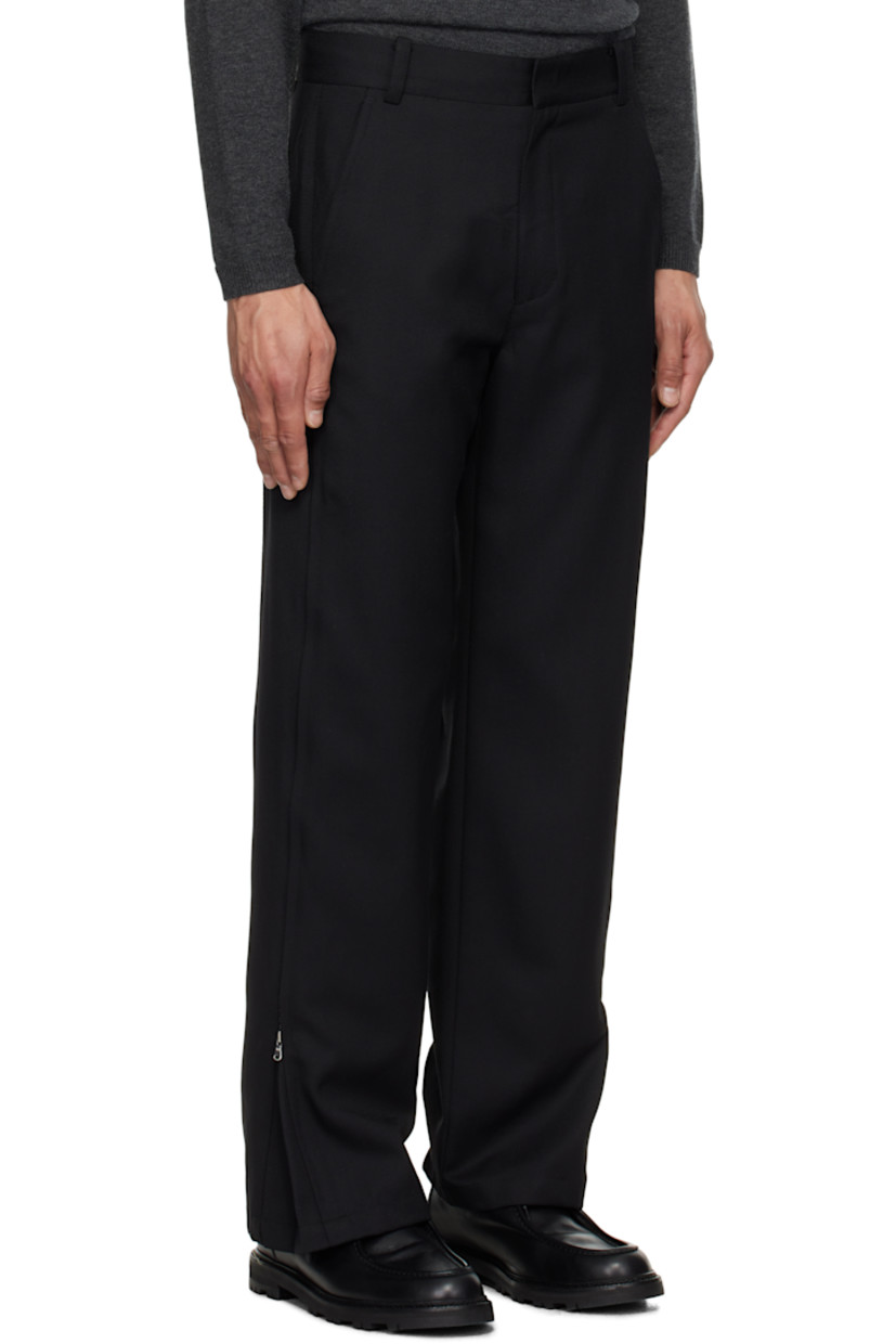 Wide-leg polyester- and wool-blend twill trousers. 

· Belt loops
· Four-pocket styling
· Zip fly
· Zip expansion panel at outseams

Supplier color: Black