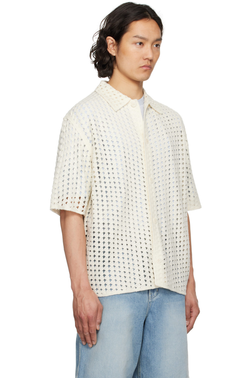 Pointelle open-knit acrylic shirt. 

· Spread collar
· Button closure

Supplier color: White