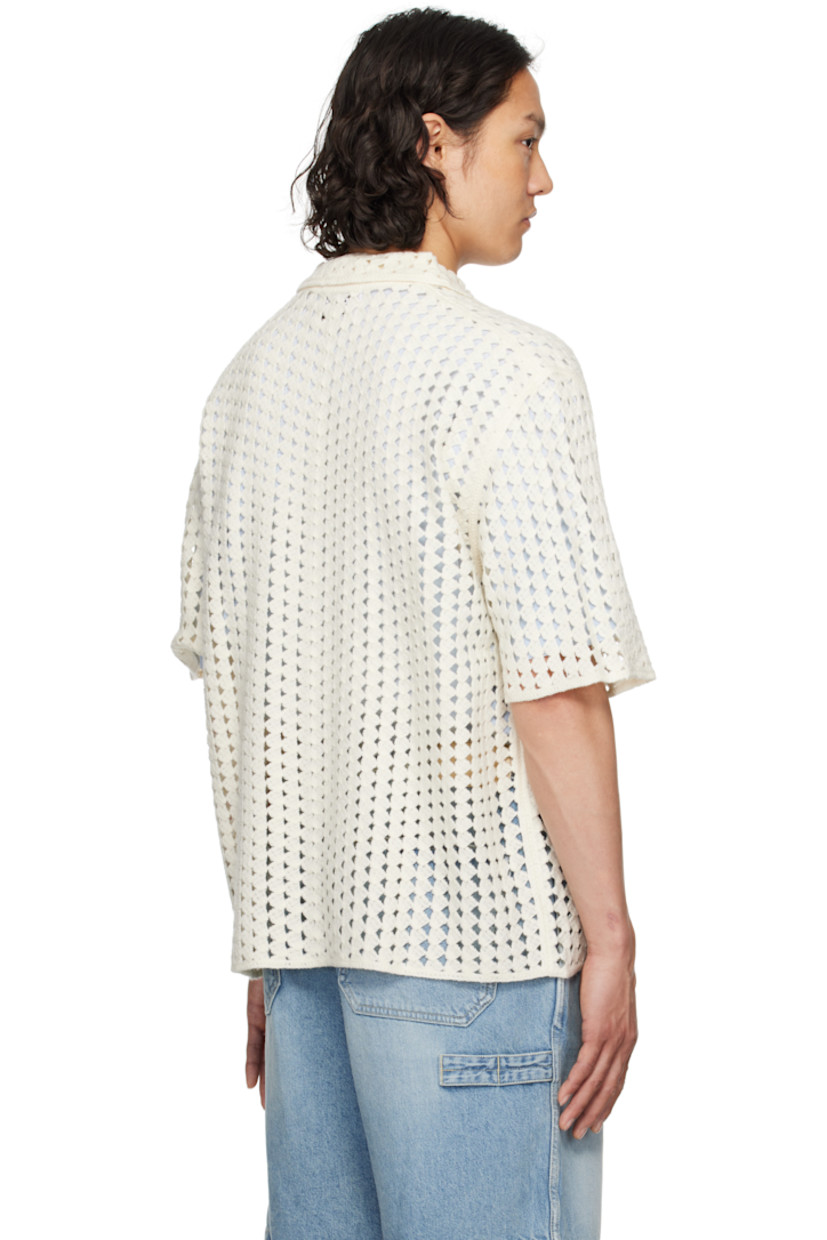 Pointelle open-knit acrylic shirt. 

· Spread collar
· Button closure

Supplier color: White
