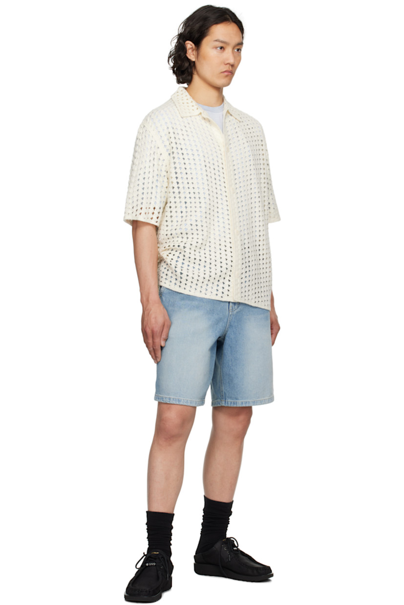 Pointelle open-knit acrylic shirt. 

· Spread collar
· Button closure

Supplier color: White