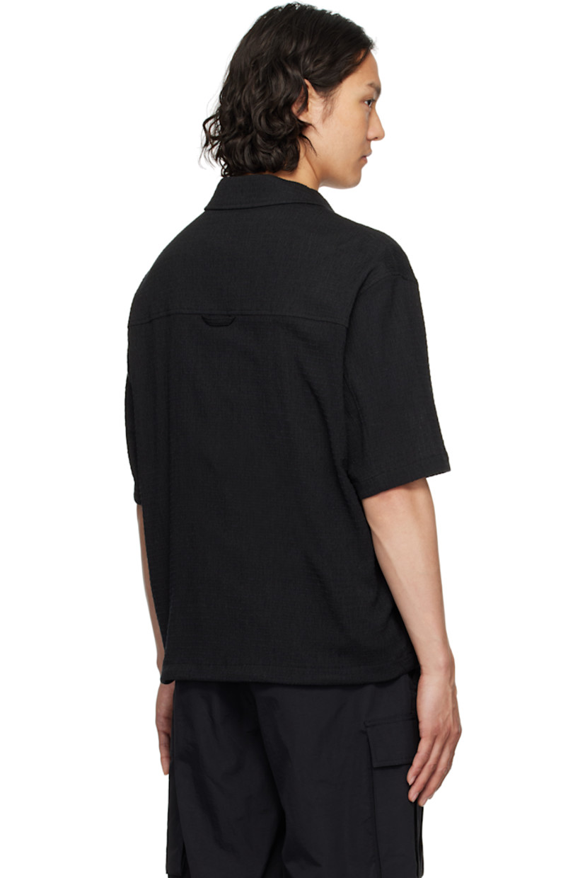 Stretch polyester- and cotton-blend gauze shirt. 

· Spread collar
· Two-way zip closure
· Patch pocket
· Bungee-style drawstring at hem
· Locker loop at yoke

Supplier color: Black
