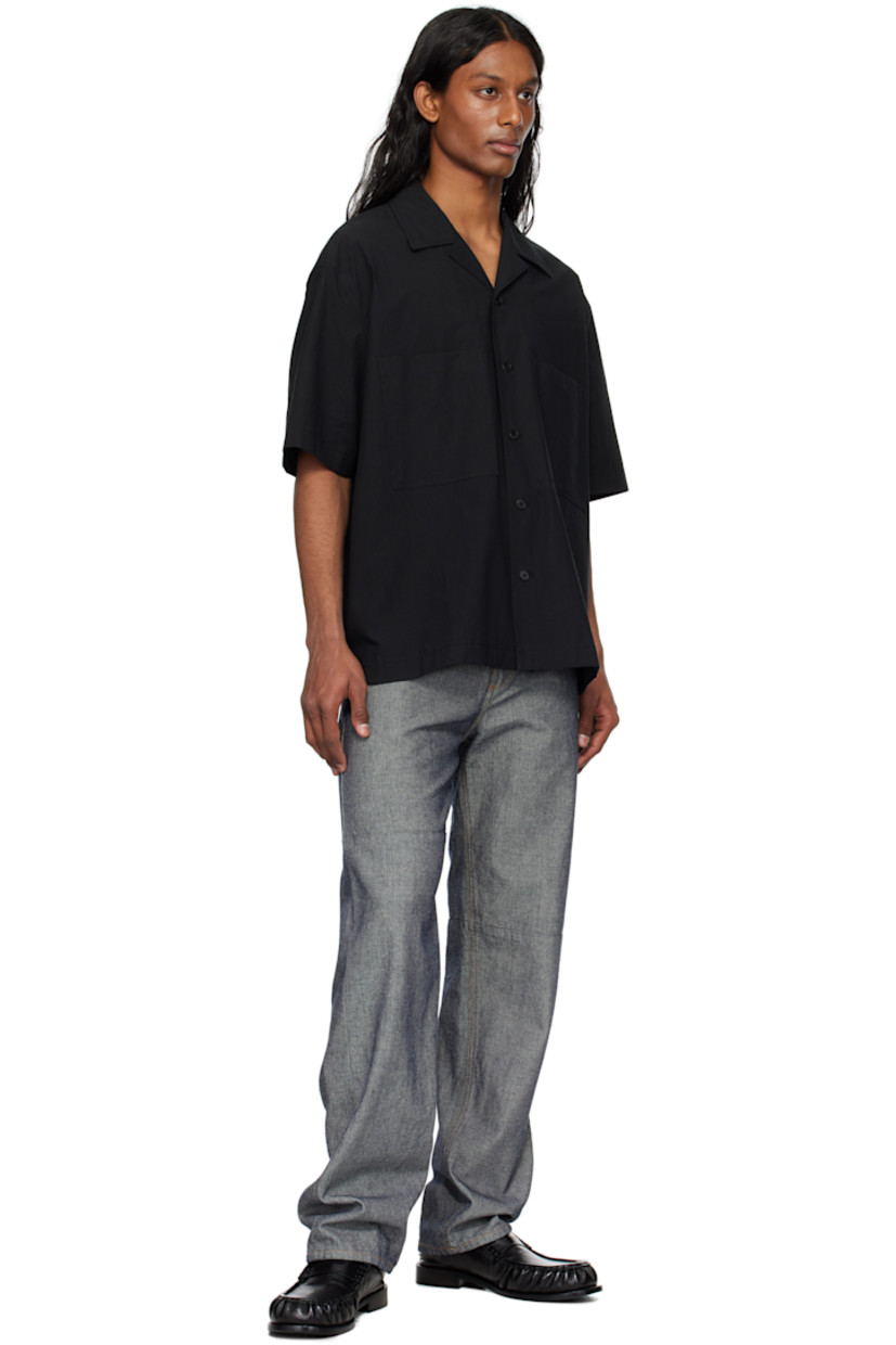 Stretch nylon poplin shirt. 

· Open spread collar
· Button closure
· Patch pockets
· Vented side seams
· Logo hardware at back collar

Supplier color: Black