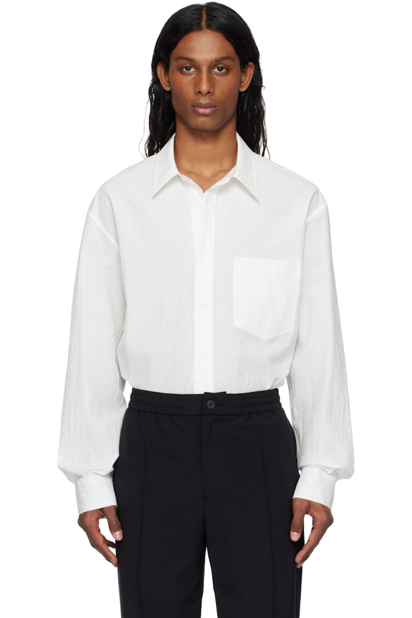 Cotton poplin shirt.

· Spread collar
· Button closure
· Patch pocket
· Shirttail hem
· Buttoned barrel cuffs
· Logo appliqué at back

Supplier color: White