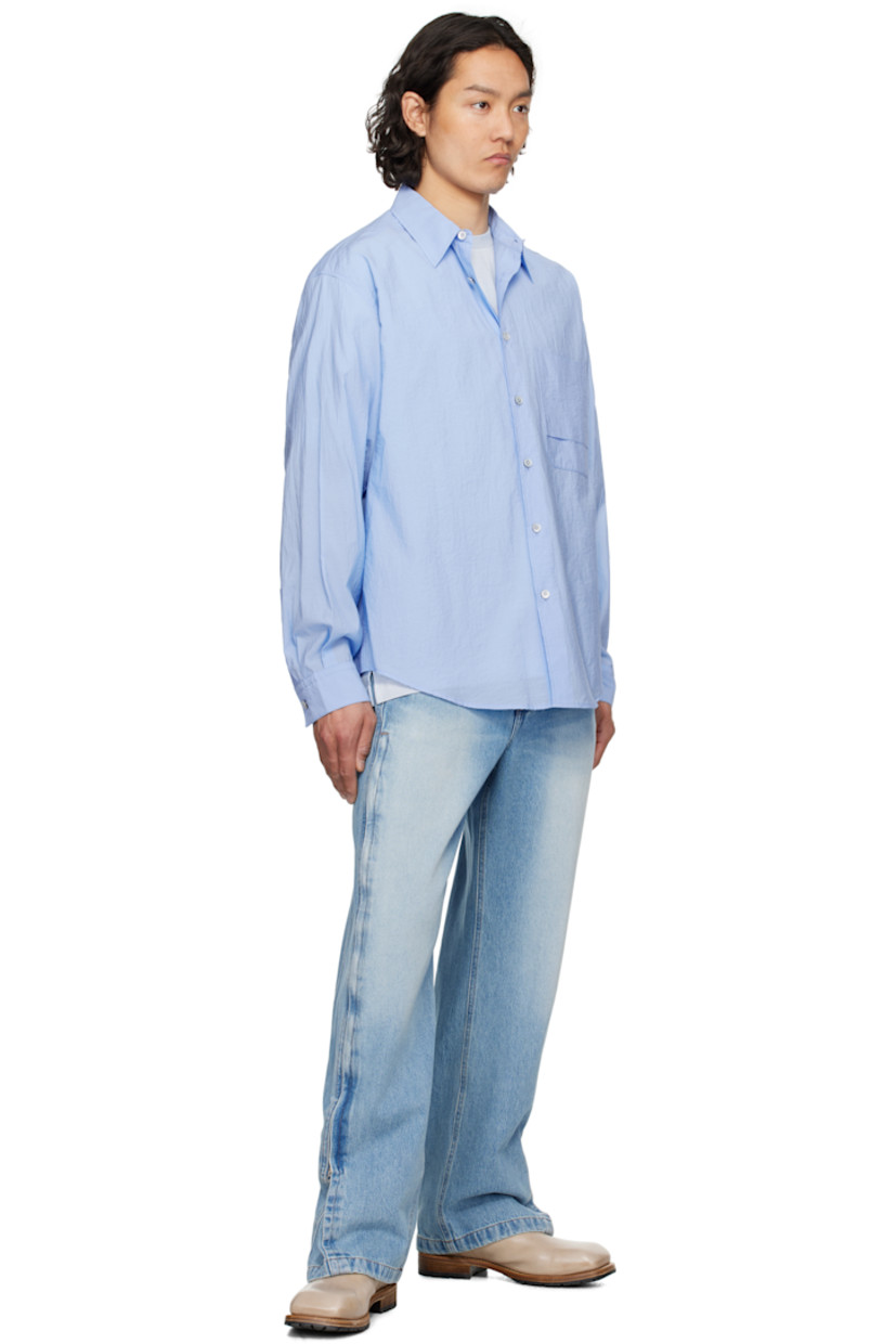Cotton- and nylon-blend poplin shirt. 

· Spread collar
· Button closure
· Patch pocket at chest
· Shirttail hem
· Single-button barrel cuffs
· Pleats at yoke

Supplier color: Blue