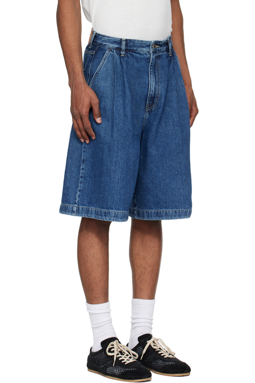 Non-stretch denim shorts. Fading throughout.

· Belt loops
· Pleats at waistband
· Four-pocket styling
· Zip fly
· Leather logo patch at back waistband
· Contrast stitching in tan

Supplier color: Blue