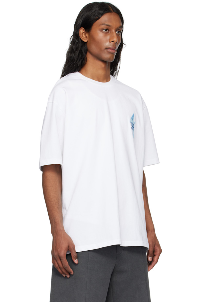 Cotton jersey T-shirt. 

· Rib-knit crewneck
· Logo, graphic, and text embroidered and printed at chest
· Dropped shoulders
· Vented side seams
· Logo graphic printed at back
· Text embroidered at back

Supplier color: White