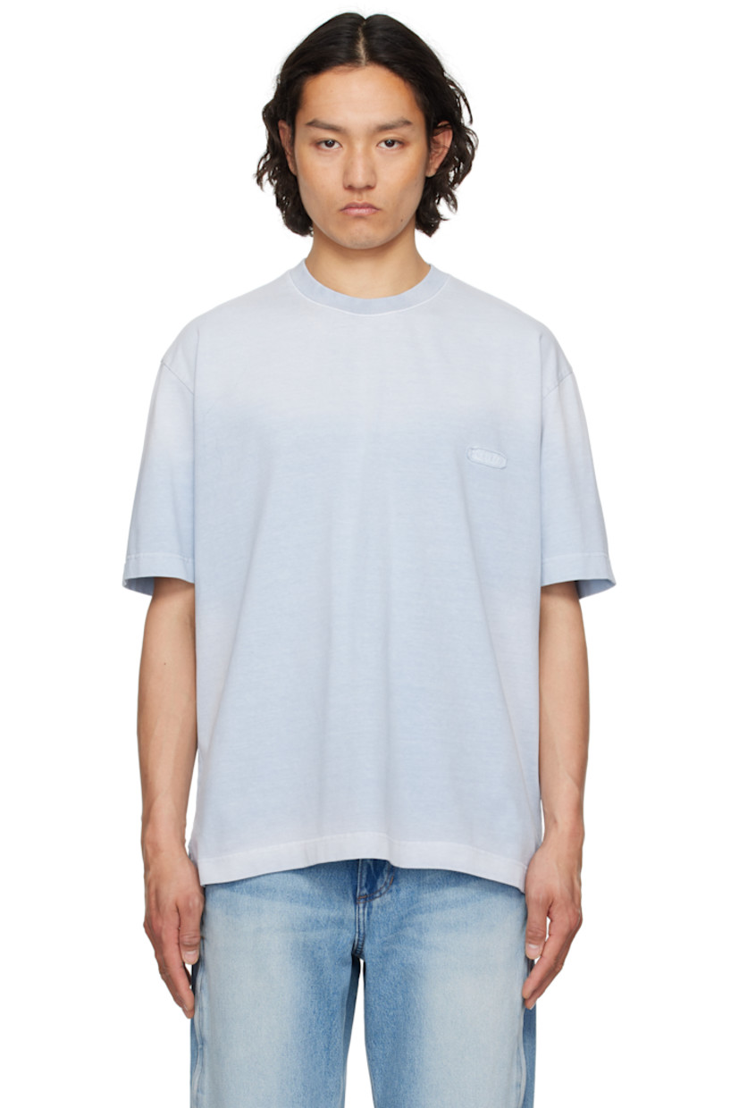 Washed cotton jersey T-shirt. Fading throughout. 

· Rib-knit crewneck
· Textile logo patch at chest
· Vent at side seams
· Dropped shoulders
· Textile logo patch and embroidered text at back

Supplier color: Light blue