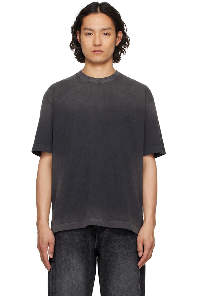 Washed cotton jersey T-shirt. Fading throughout. 

· Rib-knit crewneck
· Textile logo patch at chest
· Vent at side seams
· Dropped shoulders
· Textile logo patch and embroidered text at back

Supplier color: Black