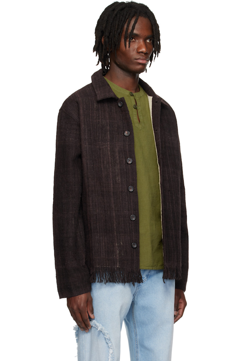 Hand-loomed wool hopsack jacket. 

· Spread collar
· Button closure
· Welt pockets
· Fringed detailing at hem
· Full plain-woven lining 
 
Supplier color: Brown
