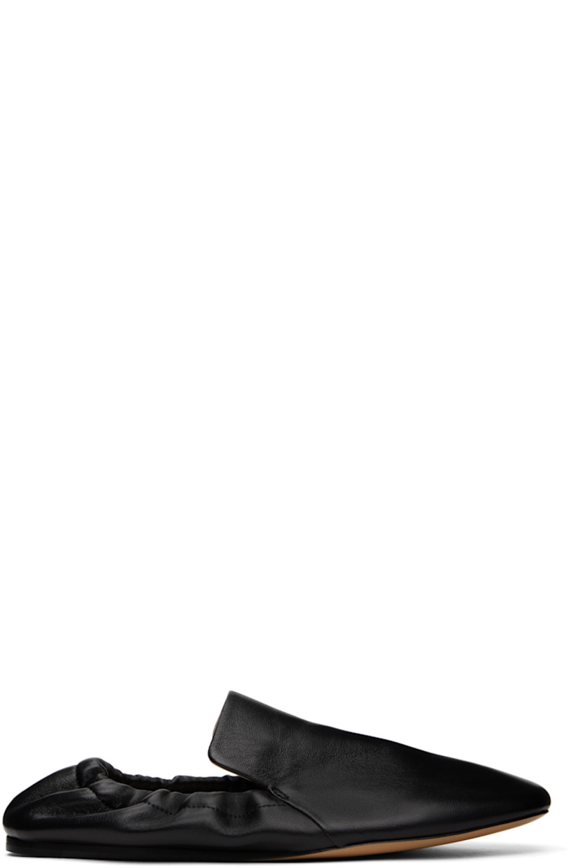 Buffed calfskin loafers in black.

· Square toe
· Elasticized collar
· Logo embossed at padded insole
· Leather sole with rubber injections

Supplier color: Black