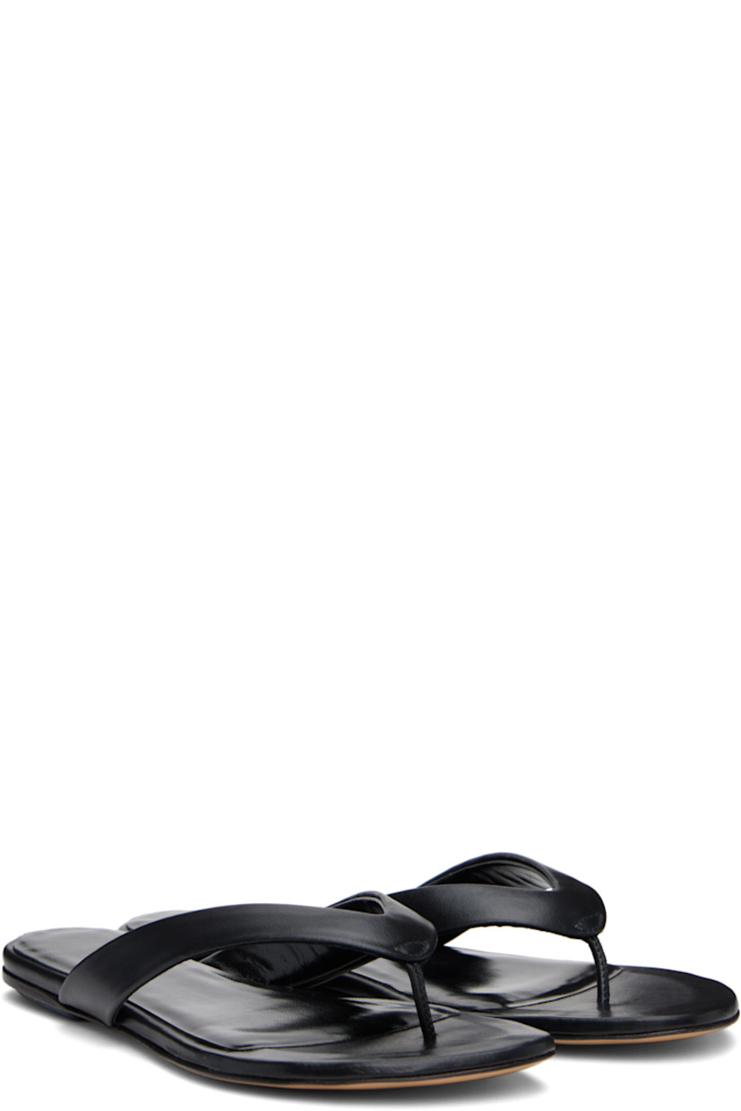 Handcrafted buffed leather sandals in black.

· Open toe
· Thong-style strap at vamp
· Logo embossed at padded footbed
· Leather sole with rubber injection

Supplier color: Black