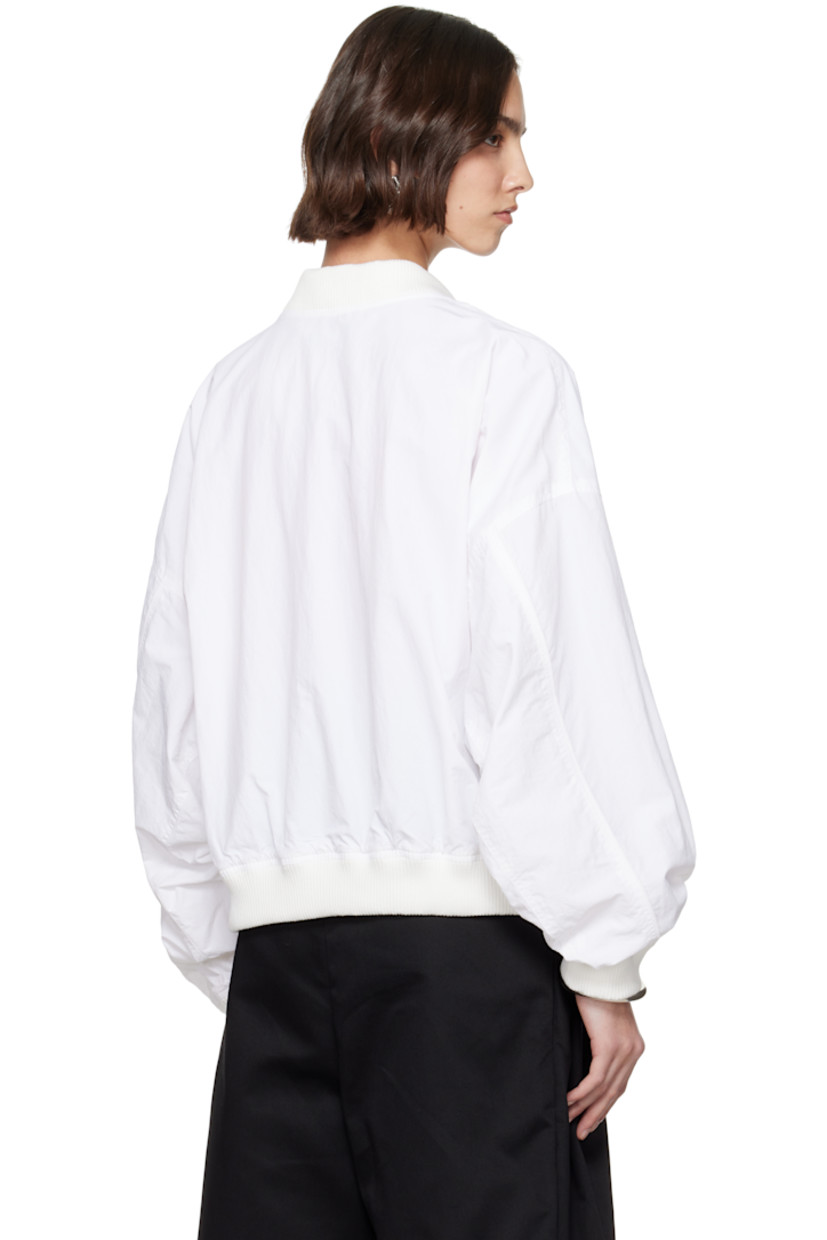 Nylon taffeta bomber jacket.

· Rib-knit stand collar, hem, and cuffs
· Zip closure
· Logo embroidered at chest
· Flap pockets
· Dropped shoulders
· Piping at sleeves
· Welt pockets at interior
· Full mesh lining

Supplier color: White
