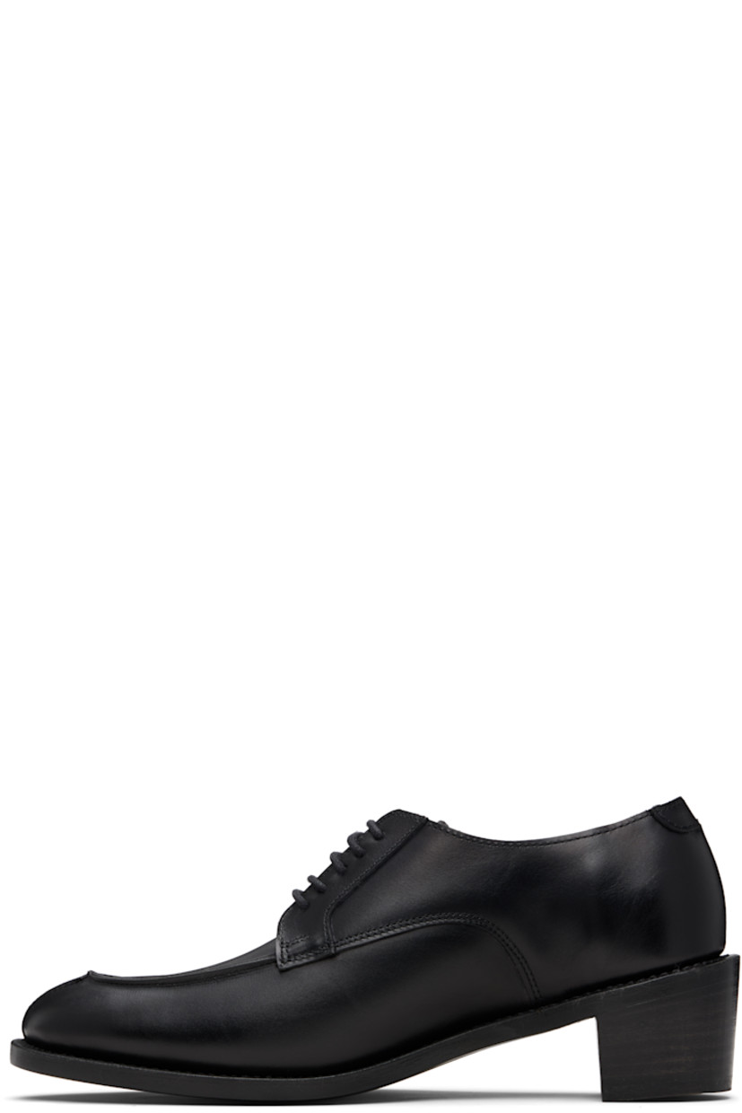 Handcrafted buffed calfskin derbys.

· Almond moc toe
· Lace-up closure
· Gold-tone logo stamp at heel
· CustomCork™ insole
· Goodyear welt
· Stacked leather block heel
· Polished vegetable-tanned calfskin sole
· Heel: H2"

Supplier color: Black