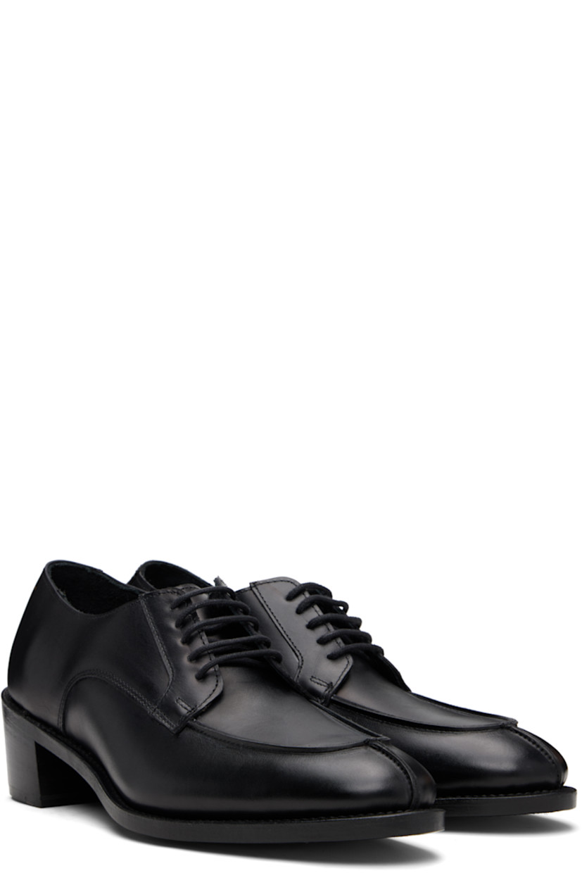 Handcrafted buffed calfskin derbys.

· Almond moc toe
· Lace-up closure
· Gold-tone logo stamp at heel
· CustomCork™ insole
· Goodyear welt
· Stacked leather block heel
· Polished vegetable-tanned calfskin sole
· Heel: H2"

Supplier color: Black