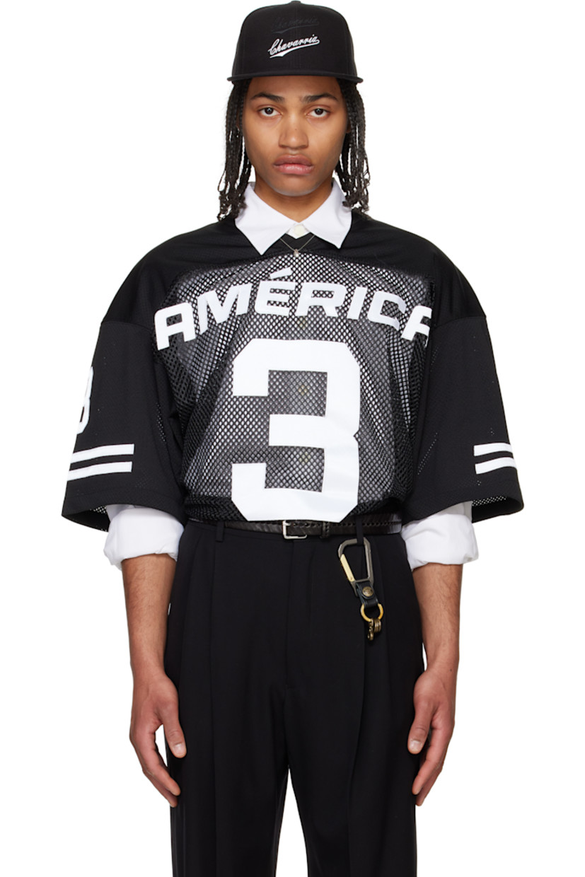 Polyester mesh T-shirt.

· Paneled construction
· Rib-knit V-neck
· Text appliqués at front, sleeves, and back
· Dropped shoulders
· Stripe appliqués at sleeves
· Embroidered logo patch at back collar

Supplier color: Black