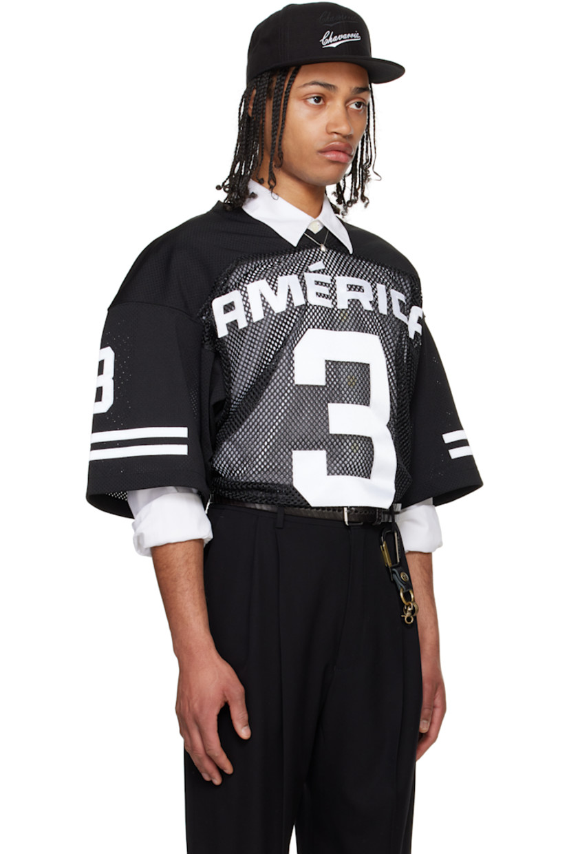 Polyester mesh T-shirt.

· Paneled construction
· Rib-knit V-neck
· Text appliqués at front, sleeves, and back
· Dropped shoulders
· Stripe appliqués at sleeves
· Embroidered logo patch at back collar

Supplier color: Black