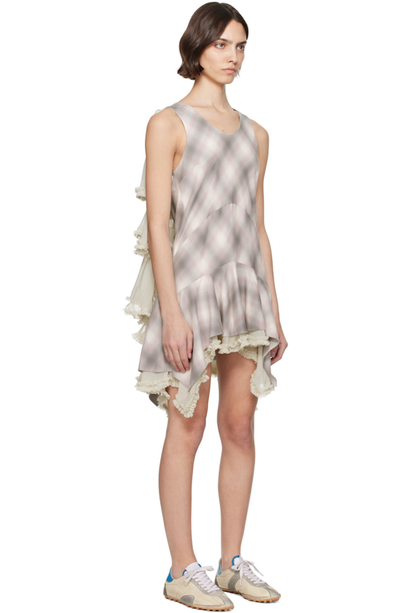 Deadstock organic cotton flannel and polyester chiffon minidress. Check pattern and ruffled trim throughout.

· V-neck 
· Handkerchief hem
· Zip closure at side seam
· Tiered cape-style trim at back

Supplier color: Lavender plaid