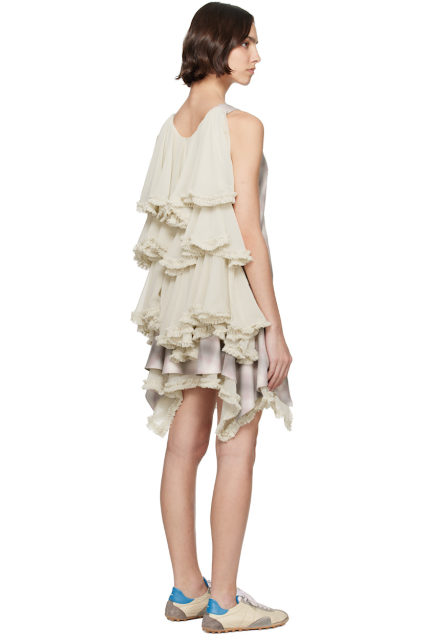 Deadstock organic cotton flannel and polyester chiffon minidress. Check pattern and ruffled trim throughout.

· V-neck 
· Handkerchief hem
· Zip closure at side seam
· Tiered cape-style trim at back

Supplier color: Lavender plaid