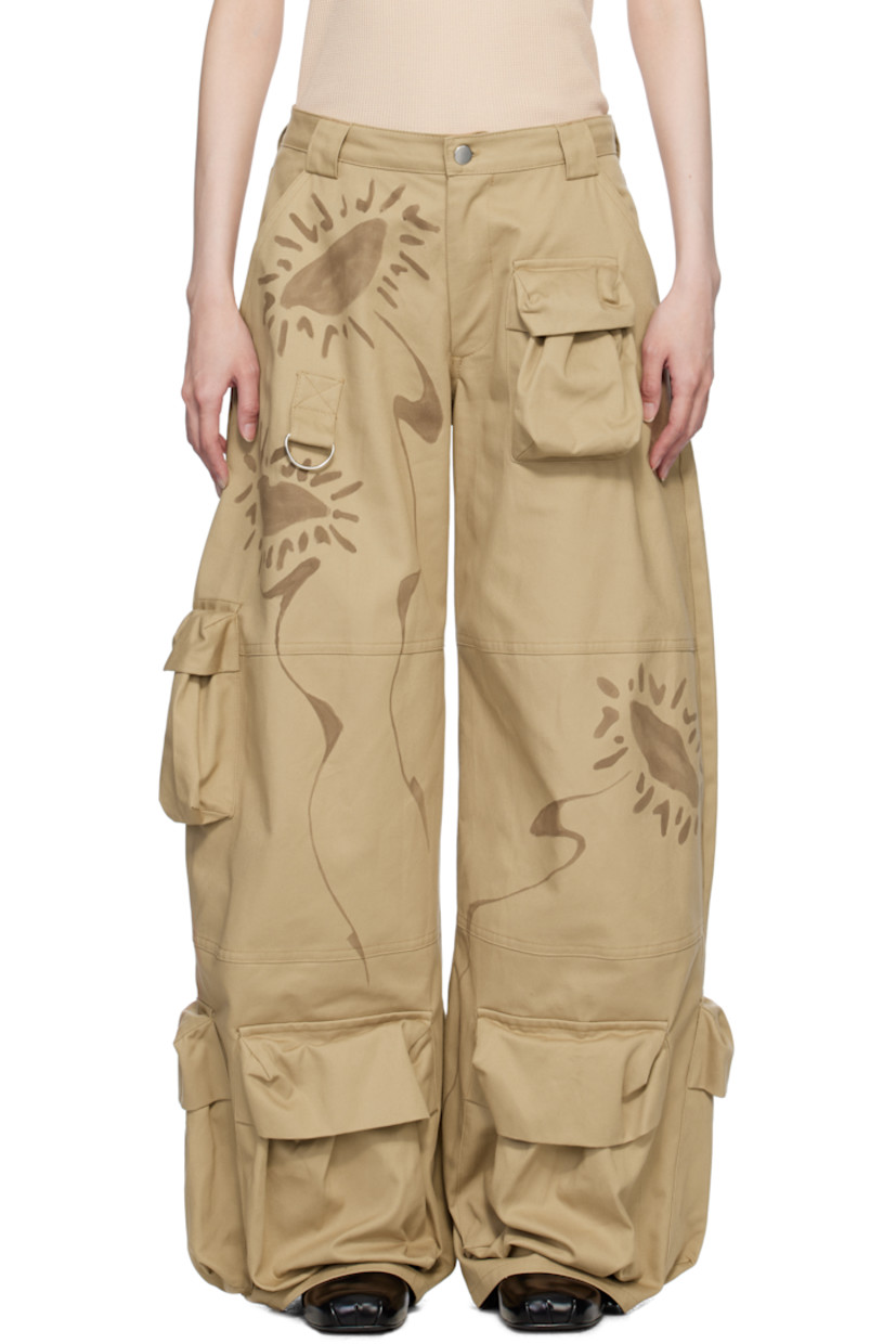 Relaxed-fit and hand-dyed cotton twill cargo pants. Hand-painted floral graphics throughout.

· Wide-leg 
· Mid-rise
· Belt loops
· Five-pocket styling
· Zip-fly
· Bellows pockets at legs
· D-ring at front

Supplier color: Sand daisy