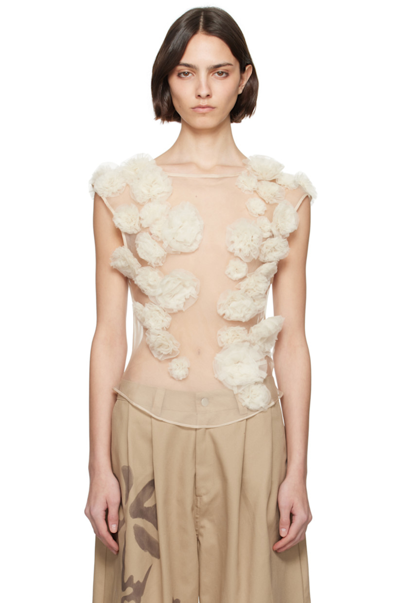 Lightweight sheer silk organza tank top. Floral appliqués throughout.

· Round neck
�· Curved hem
· Hook-eye fastening at keyhole back

Supplier color: Sand