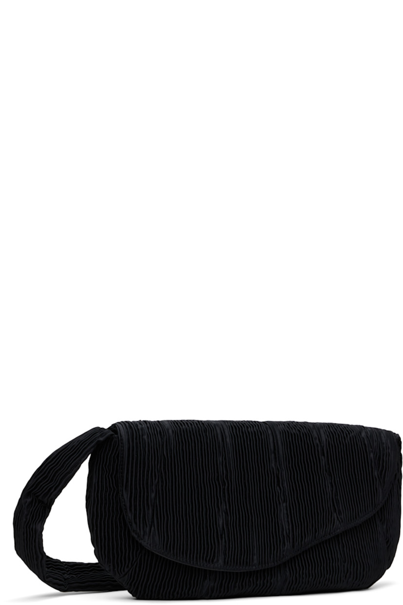 Pleated satin messenger bag in black.

· Integrated shoulder strap
· Foldover magnetic press-stud flap
· Zip closure
· Patch pocket at interior
· Twill lining
· H10" x W16" x D1.5"

Supplier color: Black