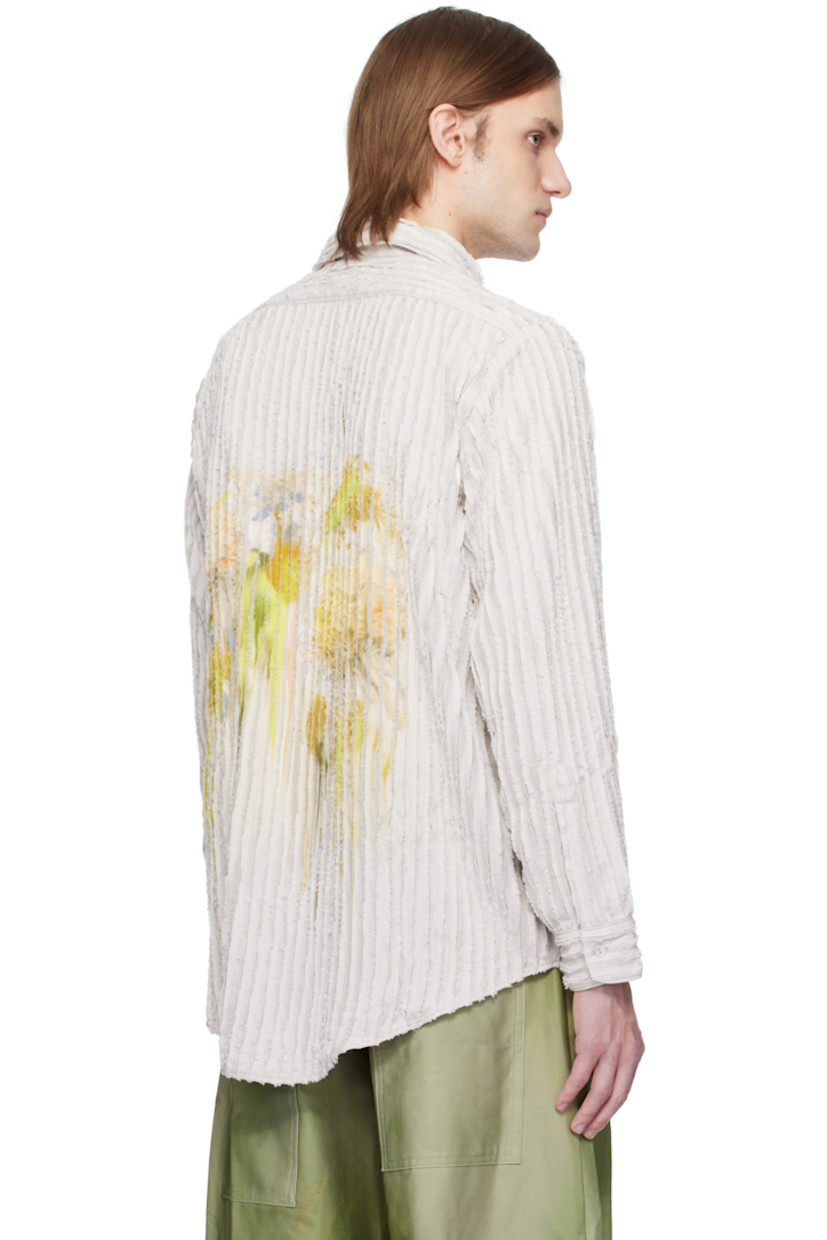 Plain-woven rayon shirt. Pinched seams with frayed edges throughout.

· Spread collar
· Button closure
· Graphic printed at patch pocket and back 
· Shirttail hem
· Buttoned barrel cuffs

Supplier color: Stone flower drip