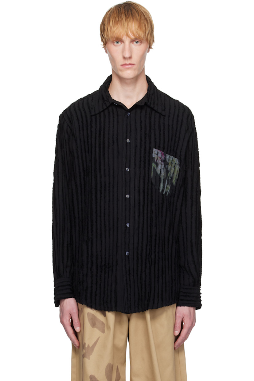 Oversized plain-woven eco rayon shirt. Frayed edges throughout.

· Paneled construction
· Spread collar
· Button closure
· Floral graphic printed at patch pocket and back
· Shirttail hem
· Dropped shoulders
· Pleated barrel cuffs

Supplier color: Black flower drip