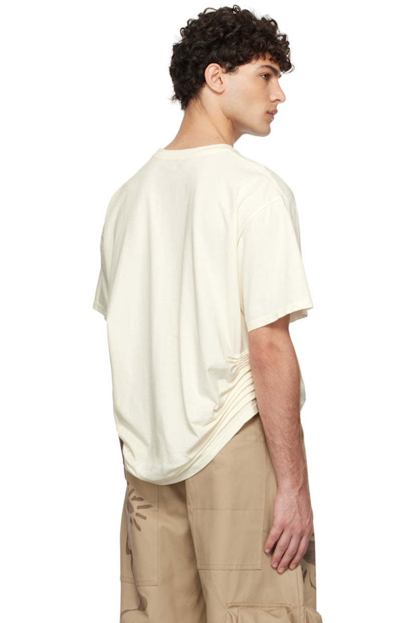 Boxy-fit organic cotton jersey T-shirt. 

· Rib-knit crewneck
· Graphic and text printed at front
· Pleats at side seams
· Dropped shoulders

Each item is unique. Please note that coloration may vary.

Supplier color: Intentions