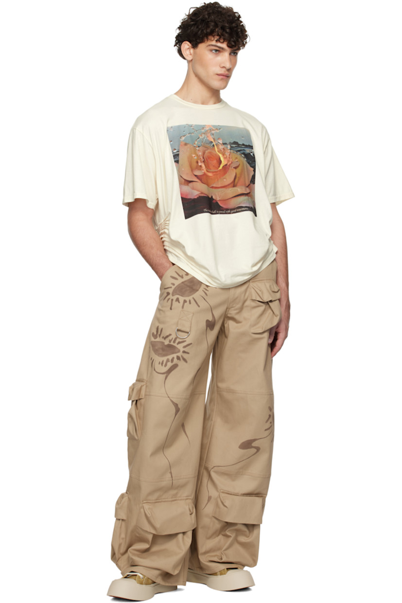 Boxy-fit organic cotton jersey T-shirt. 

· Rib-knit crewneck
· Graphic and text printed at front
· Pleats at side seams
· Dropped shoulders

Each item is unique. Please note that coloration may vary.

Supplier color: Intentions