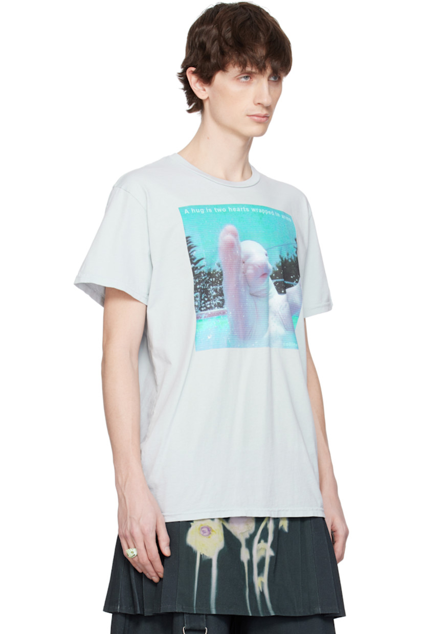 Hand-dyed organic cotton jersey T-shirt. 

· Rib-knit crewneck
· Graphic, logo, and text printed at front

Supplier color: A hug