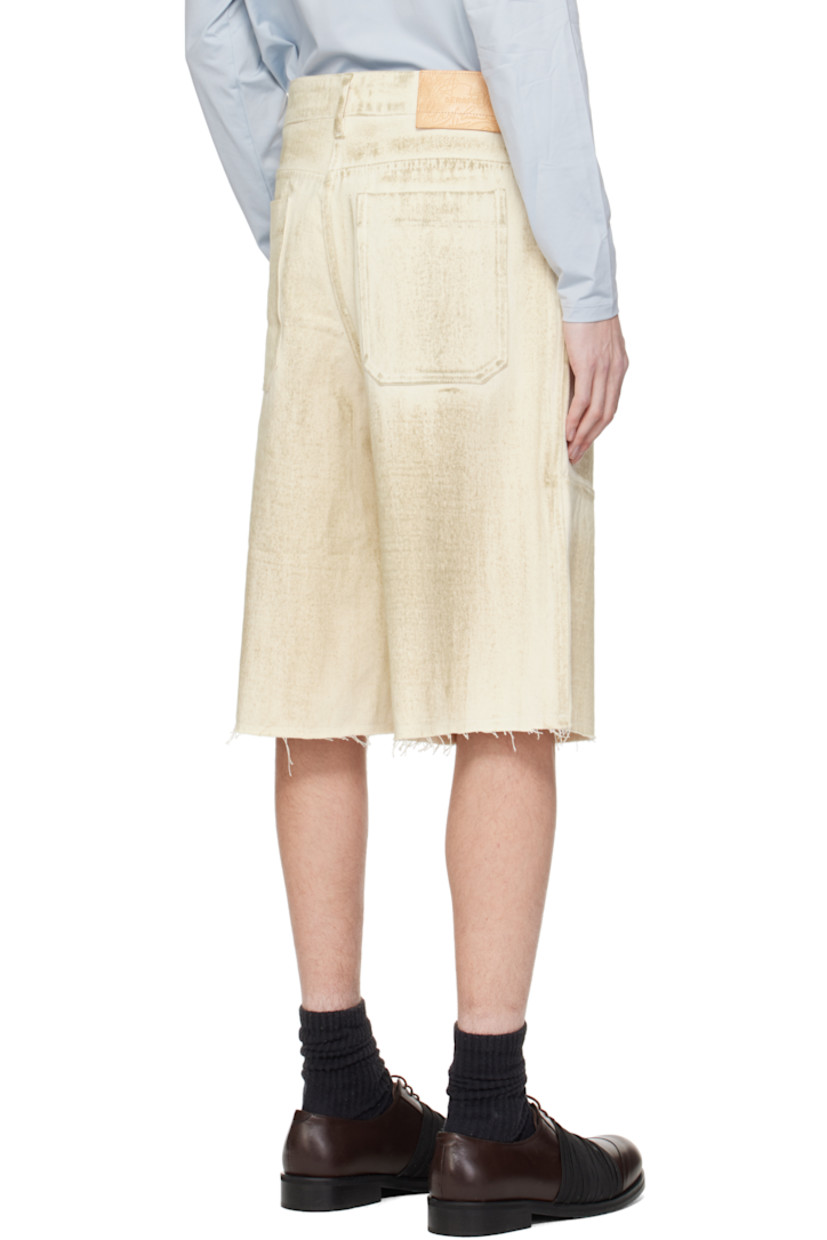 Cotton twill shorts. Smudging throughout.

· Belt loops
· Four-pocket styling
· Zip fly
· Frayed edge at cuffs
· Logo patch at back waistband

Supplier color: Ecru