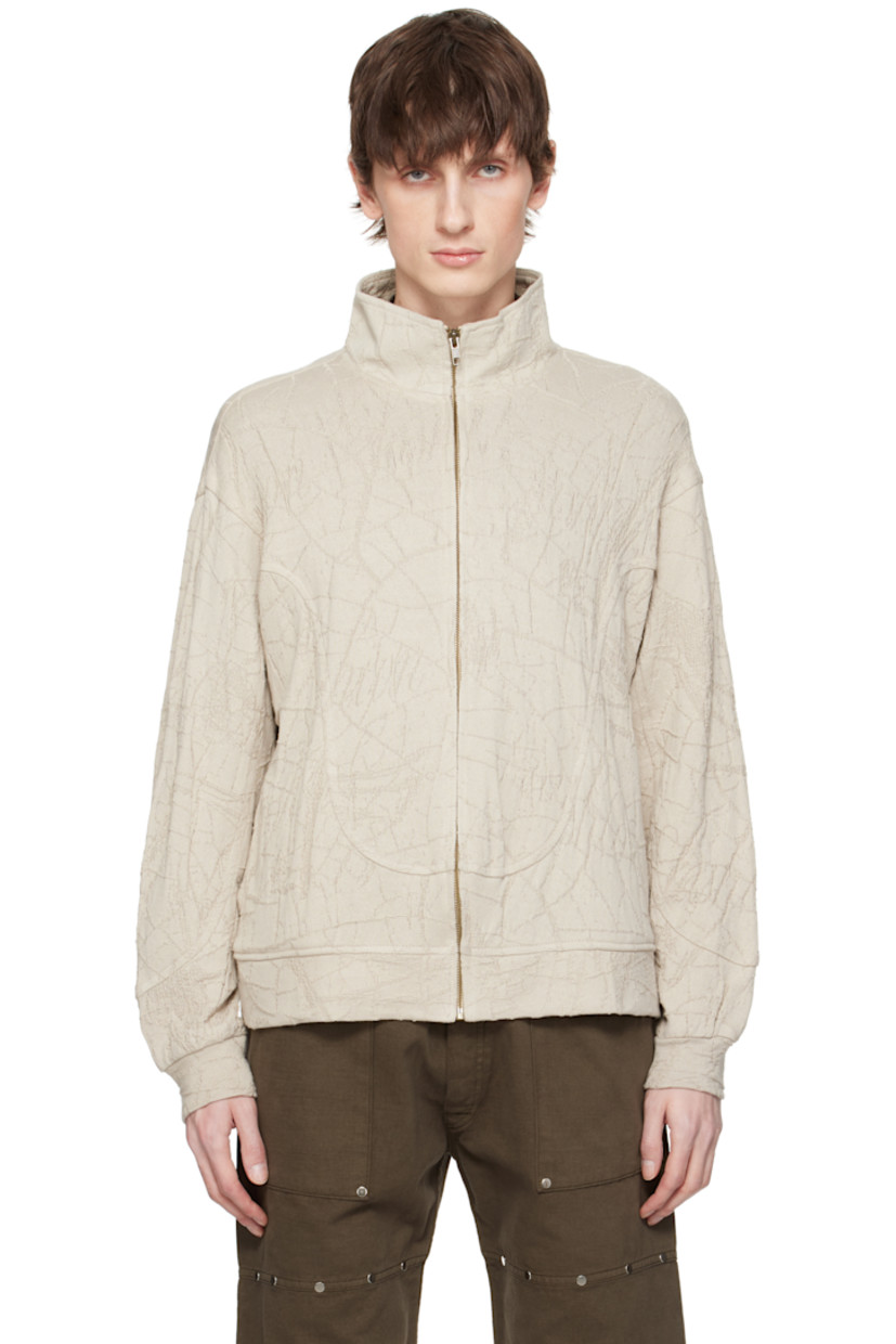 Textured knit cotton track jacket.

· Stand collar
· Zip closure
· Seam pockets

Supplier color: Beige