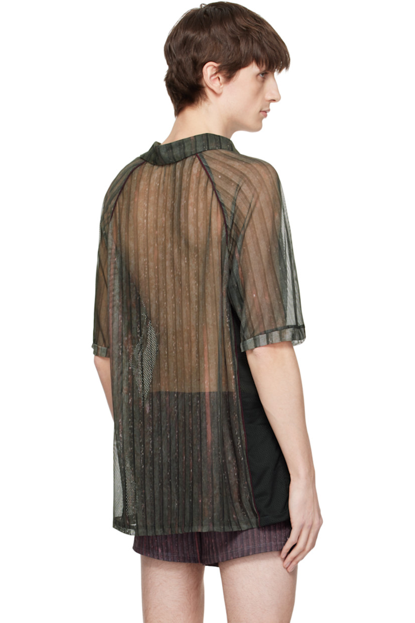 Semi-sheer stretch polyester mesh polo. Piping and stripes throughout.

· Spread collar
· Open placket
· Logos and text printed at front
· Raglan sleeves

Supplier color: Print