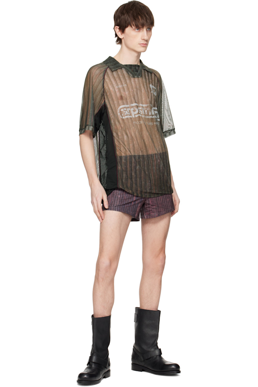 Semi-sheer stretch polyester mesh polo. Piping and stripes throughout.

· Spread collar
· Open placket
· Logos and text printed at front
· Raglan sleeves

Supplier color: Print
