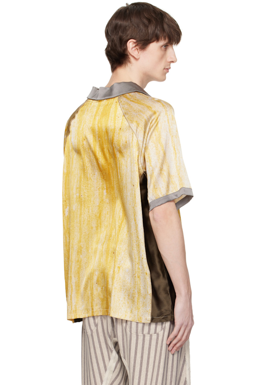 Stretch silk satin polo. Piping and printed graphic pattern throughout.

· Spread collar
· Open placket
· Embroidered logos and printed text at front
· Raglan sleeves

Supplier color: Yellow