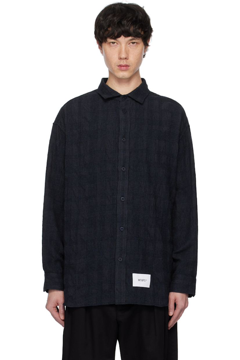 Wool- and cotton-blend flannel shirt. Check pattern throughout.

· Spread collar
· Button closure
· Logo patch at front hem
· Shirttail hem 
· Adjustable single-button barrel cuffs

Supplier color: Navy