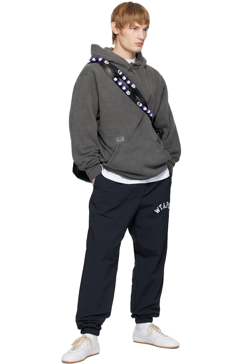Cotton- and recycled polyester-blend fleece hoodie.

· Drawstring at hood
· Logo patch at front
· Kangaroo pocket
· Logo flag at side seam
· Rib-knit hem and cuffs
· Dropped shoulders 
· Embroidered logo at back

Supplier color: Black