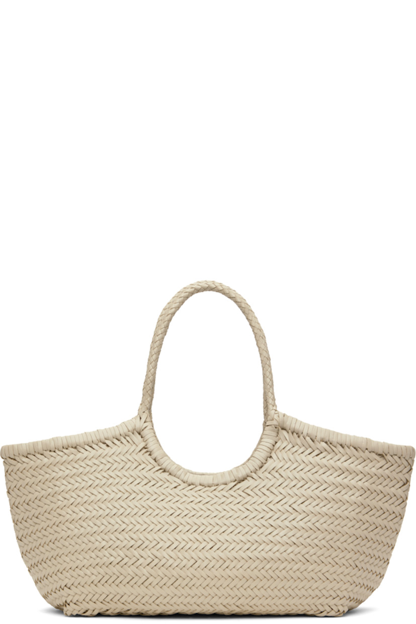 Hand-woven buffalo calfskin top handle bag in off-white.

· Twin carry handles
· Open throat
· Hand-sewn logo disc at interior
· Unlined
· H9.5" x W19" x D6"
· Total height: H17"

Supplier color: Pearl