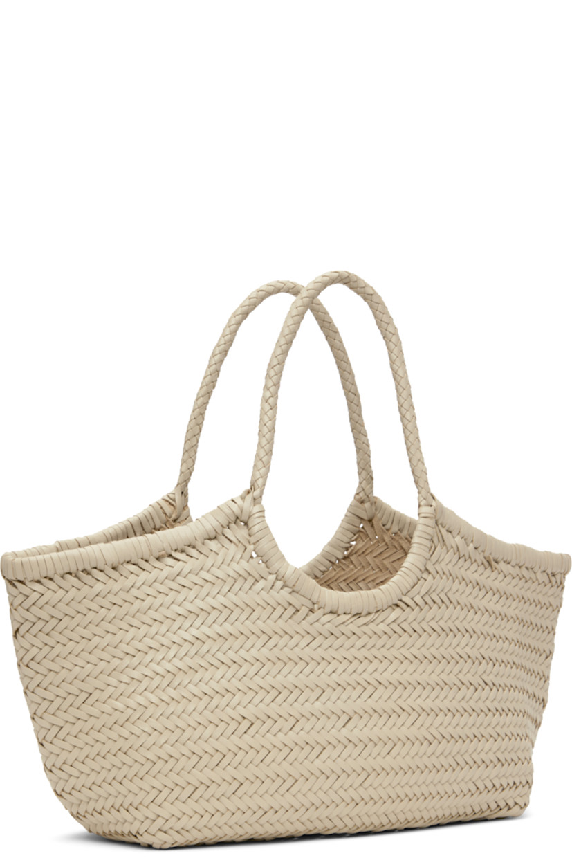 Hand-woven buffalo calfskin top handle bag in off-white.

· Twin carry handles
· Open throat
· Hand-sewn logo disc at interior
· Unlined
· H9.5" x W19" x D6"
· Total height: H17"

Supplier color: Pearl