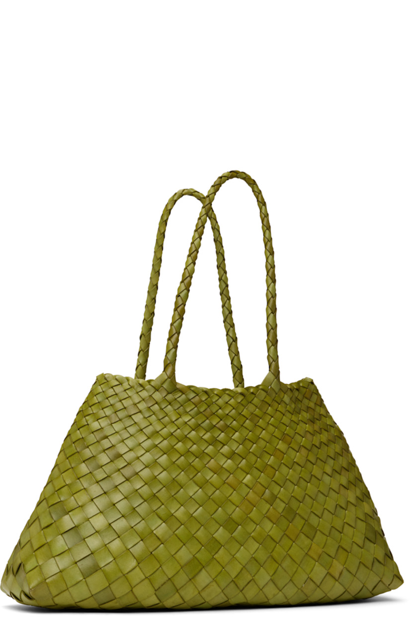 Handcrafted basket-woven buffalo calfskin tote in green.

· Twin carry handles
· Open throat
· Logo disc hand-sewn at interior
· Unlined
· H8.75" x W17.5" x D6"
· Total height: H17.5"

Supplier color: Bamboo green